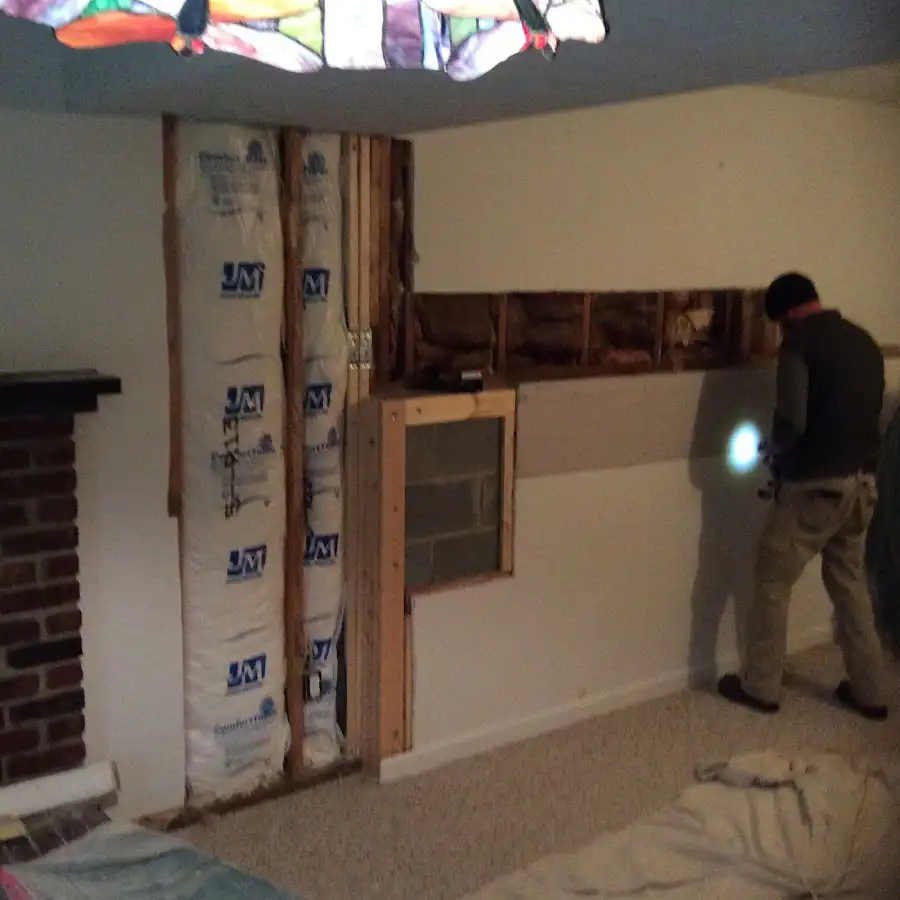 Restoration technician inspecting water damage in Jacksonville